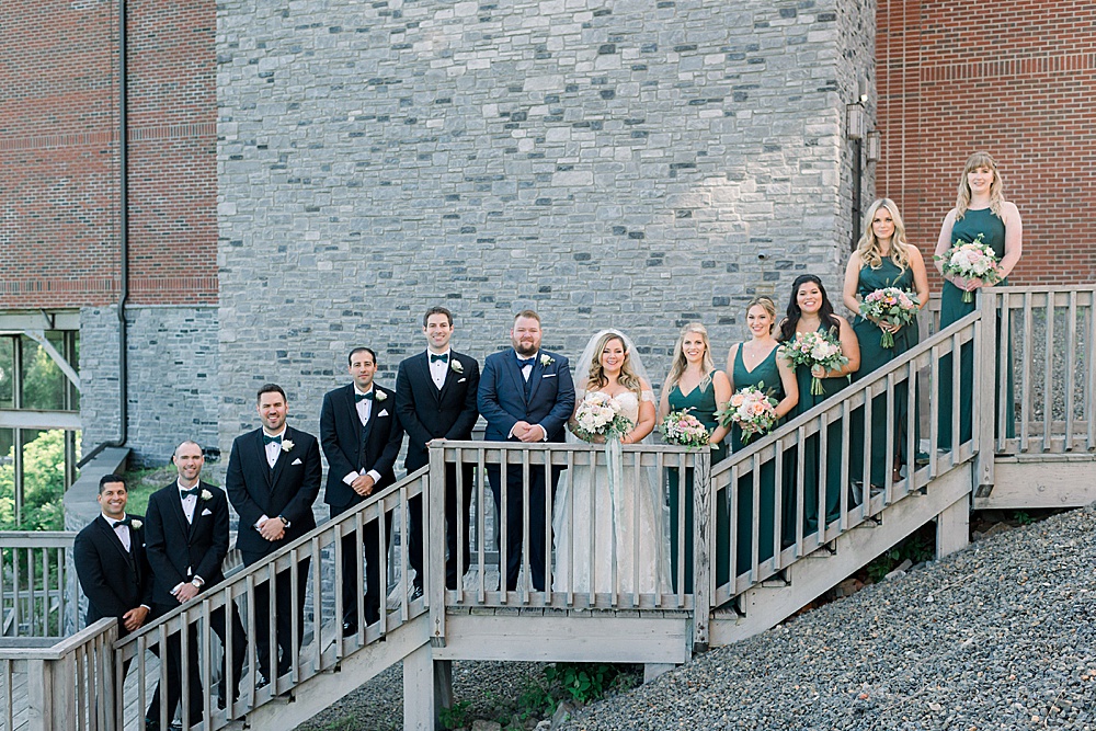 wedding party on wooden stairs