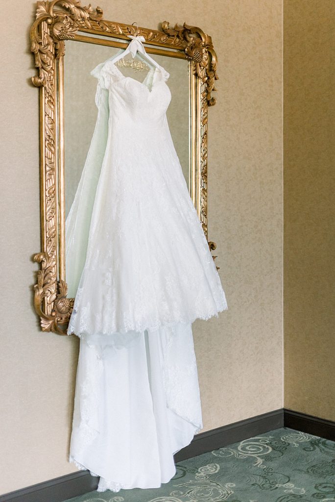 weddinig gown hanging on mirror