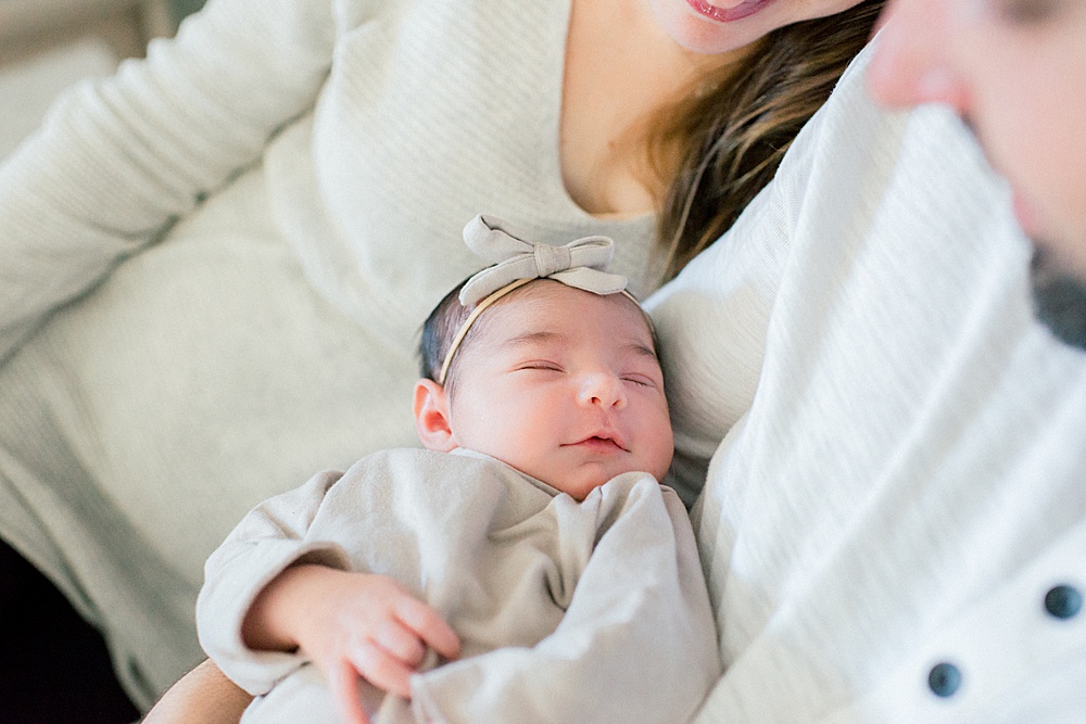newborn baby girl smiling in sleep