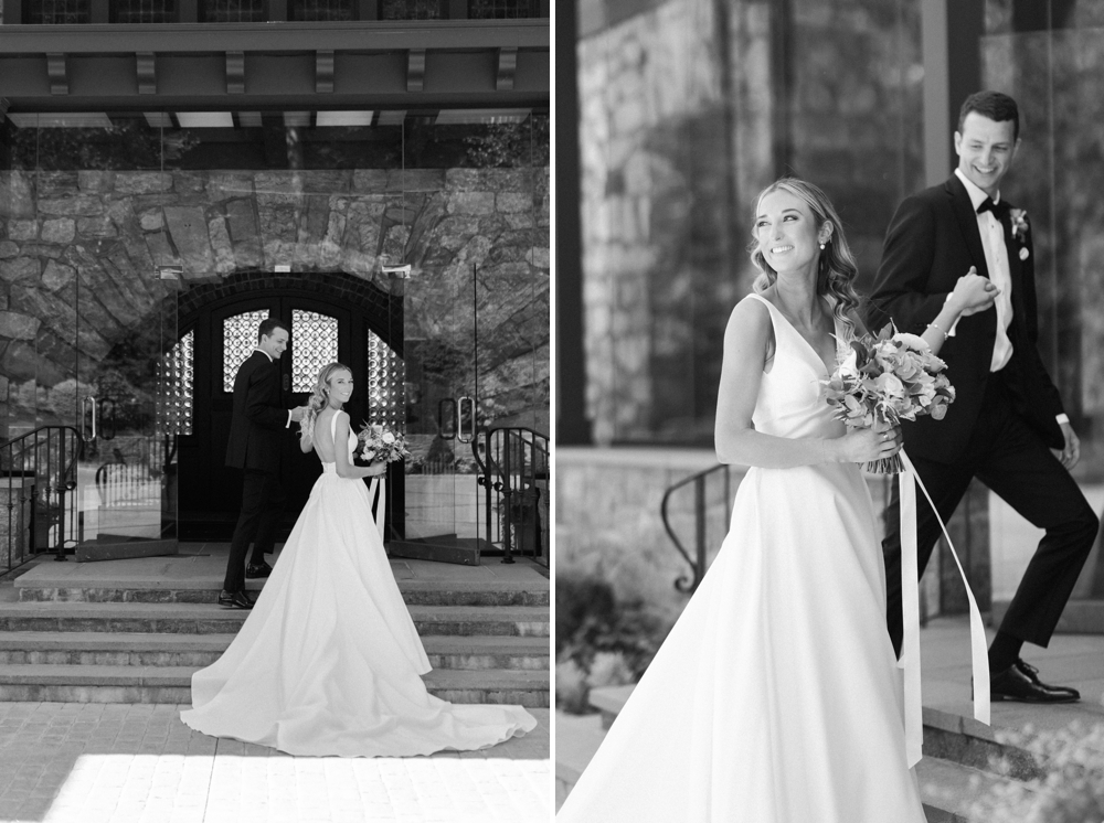 A bride and groom walk up the steps of Le Chateau holding hands